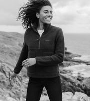 Model wearing a Finisterre recycled wool fleece