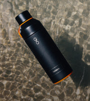 Ocean bottle floating on shallow water