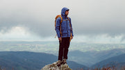 man wearing finisterre coats next to river